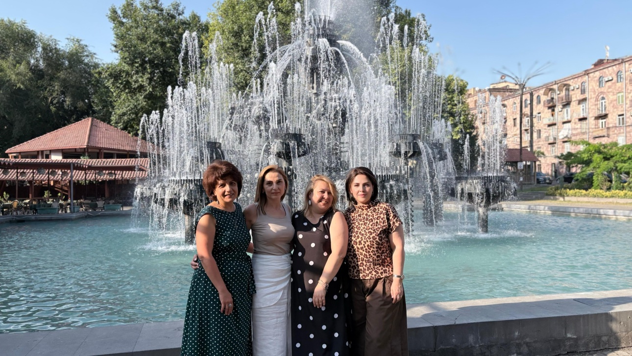 Dr. Mariam Ohanyan with her biology teacher friends by the fountain